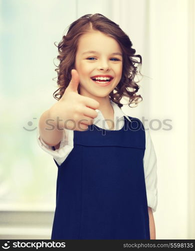 picture of beautiful pre-teen girl showing thumbs up