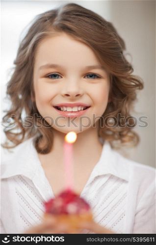 picture of beautiful pre-teen girl with cupcake
