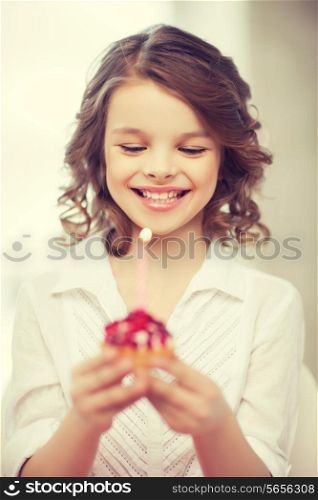picture of beautiful pre-teen girl with cupcake