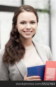 picture of beautiful smiling woman with folder