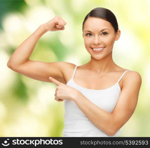 picture of beautiful sporty woman flexing her biceps