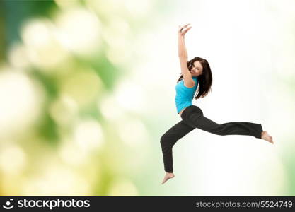 picture of beautiful sporty woman jumping in sportswear