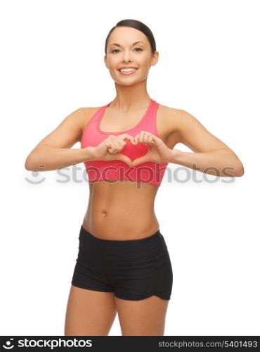 picture of beautiful sporty woman showing heart shape