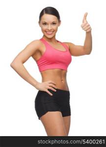 picture of beautiful sporty woman showing thumbs up