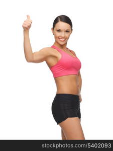 picture of beautiful sporty woman showing thumbs up