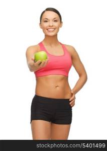 picture of beautiful sporty woman with apple