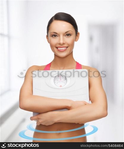 picture of beautiful sporty woman with scale