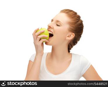 picture of beautiful teenage biting a green apple