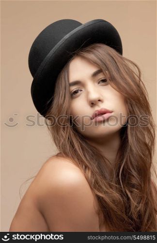 picture of beautiful topless woman in bowler hat