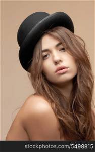 picture of beautiful topless woman in bowler hat