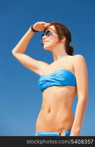 picture of beautiful woman in bikini and sunglasses