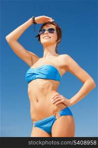 picture of beautiful woman in bikini and sunglasses
