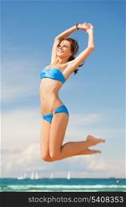 picture of beautiful woman in bikini jumping