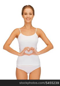 picture of beautiful woman in cotton undrewear forming heart shape on belly .