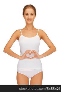 picture of beautiful woman in cotton undrewear forming heart shape on belly .