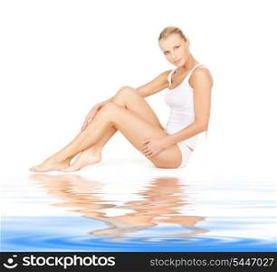 picture of beautiful woman in cotton undrewear on white sand