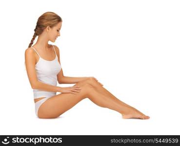 picture of beautiful woman in cotton undrewear touching her legs