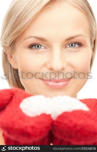 picture of beautiful woman in mittens with snow