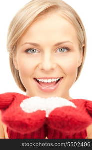 picture of beautiful woman in red mittens with snow