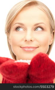 picture of beautiful woman in red mittens with snow