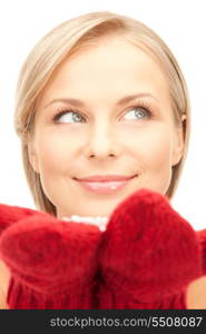 picture of beautiful woman in red mittens with snow