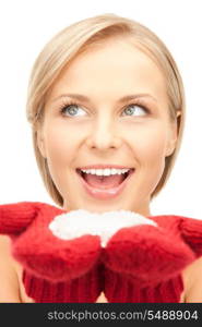 picture of beautiful woman in red mittens with snow&#xA;