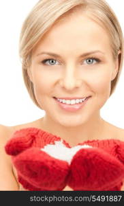 picture of beautiful woman in red mittens with snow&#xA;