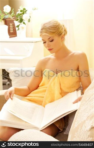 picture of beautiful woman in spa salon with book