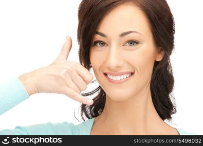 picture of beautiful woman making a call me gesture