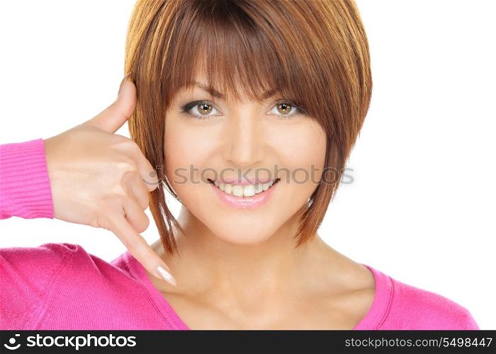 picture of beautiful woman making a call me gesture