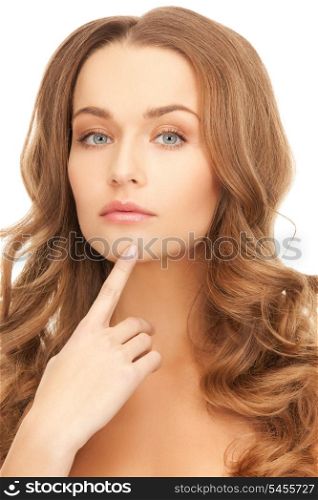 picture of beautiful woman pointing to chin.