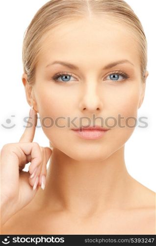 picture of beautiful woman pointing to ear
