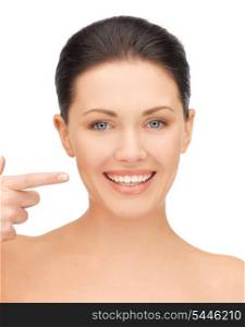 picture of beautiful woman pointing to teeth