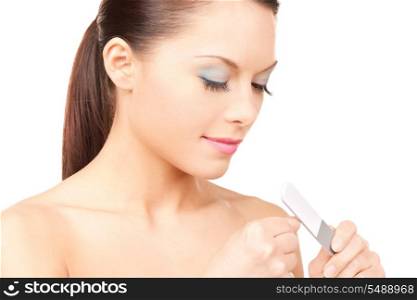.picture of beautiful woman polishing her nails. .