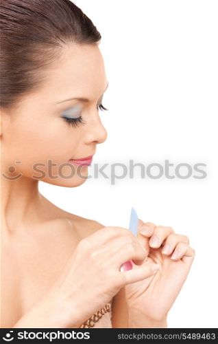 .picture of beautiful woman polishing her nails. .