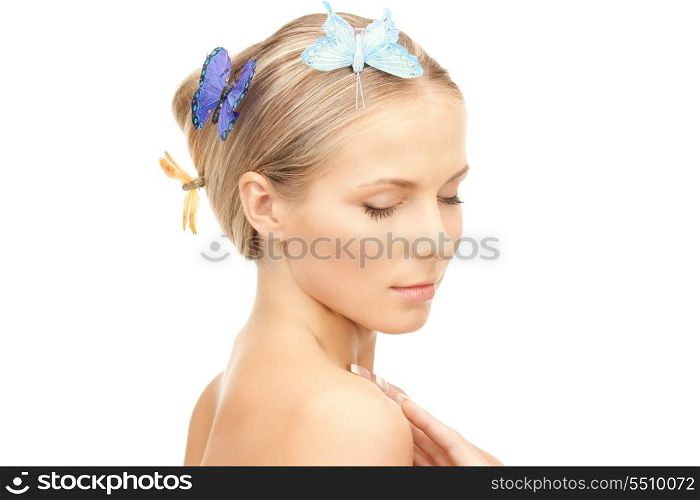 picture of beautiful woman with butterfly in hair.