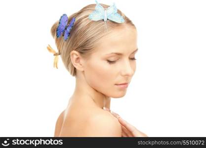 picture of beautiful woman with butterfly in hair.