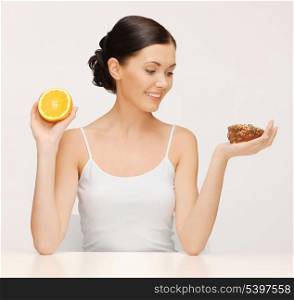 picture of beautiful woman with cake and orange