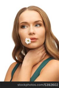 picture of beautiful woman with camomile in mouth