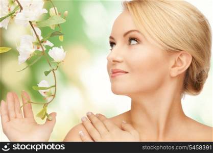 picture of beautiful woman with flowers on twig