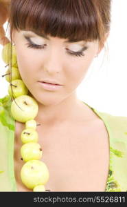 picture of beautiful woman with green apples