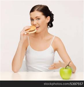 picture of beautiful woman with hamburger and vegetables