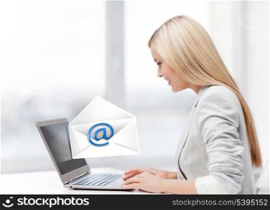 picture of beautiful woman with laptop computer sending email
