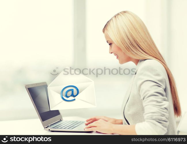 picture of beautiful woman with laptop computer sending email. woman with laptop computer