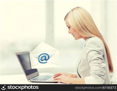 picture of beautiful woman with laptop computer sending email. woman with laptop computer