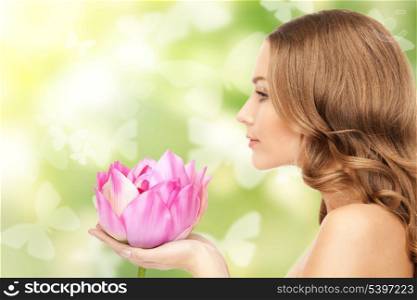 picture of beautiful woman with lotus flower and butterflies