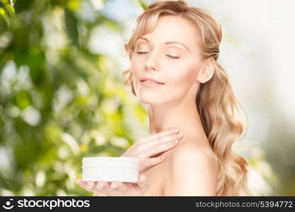 picture of beautiful woman with moisturizing creme