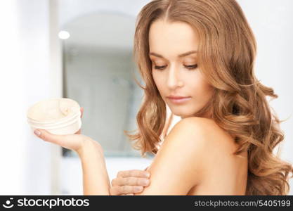 picture of beautiful woman with moisturizing creme