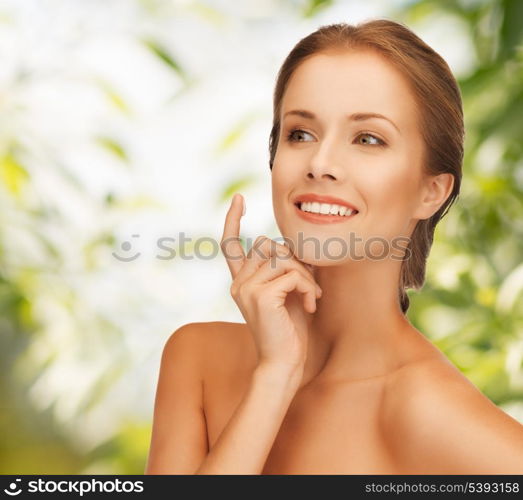 picture of beautiful woman with moisturizing creme drop