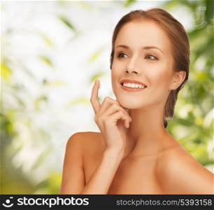picture of beautiful woman with moisturizing creme drop